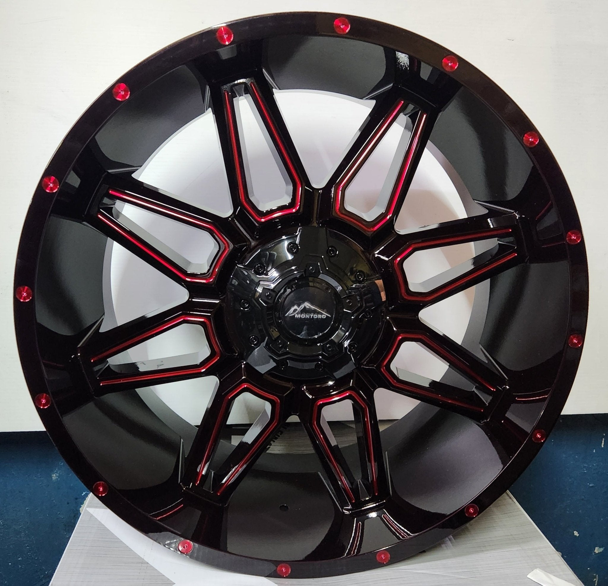 M12 22X10 BLANKMM MIDNIGHT BLACK MG RED TINT RED RIVETS - Gun Hill Tire House (WTW - WHOLESALE TIRES & WHEELS)